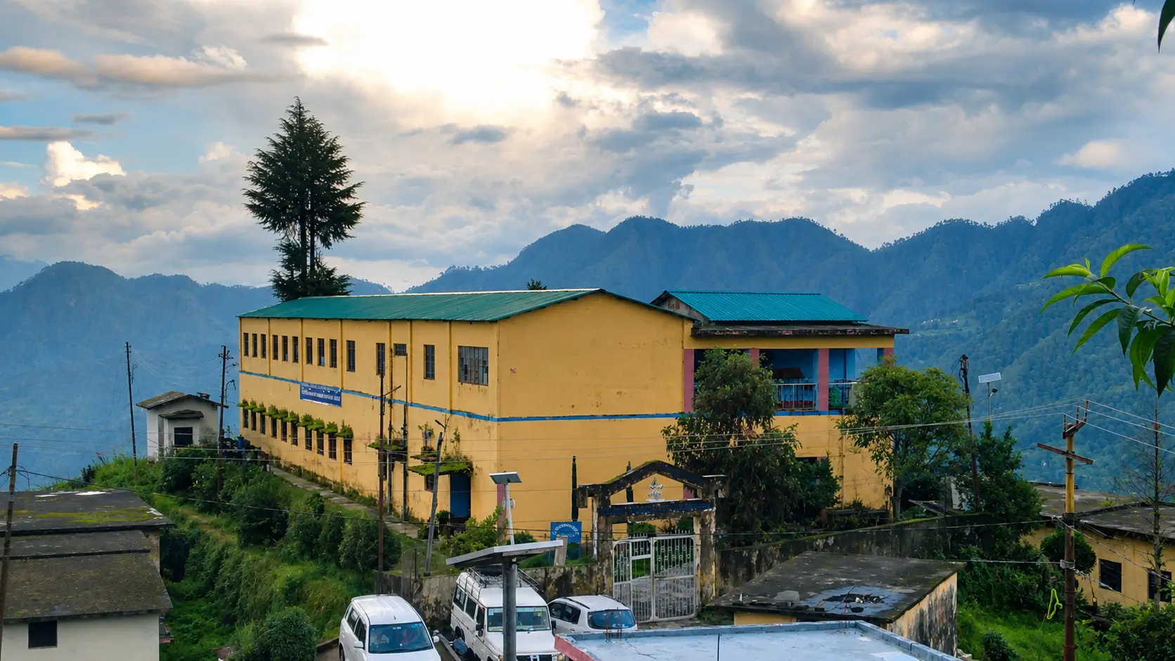 Govt. Inter College Ramashram above Jakholi, with the Garhwal hills behind